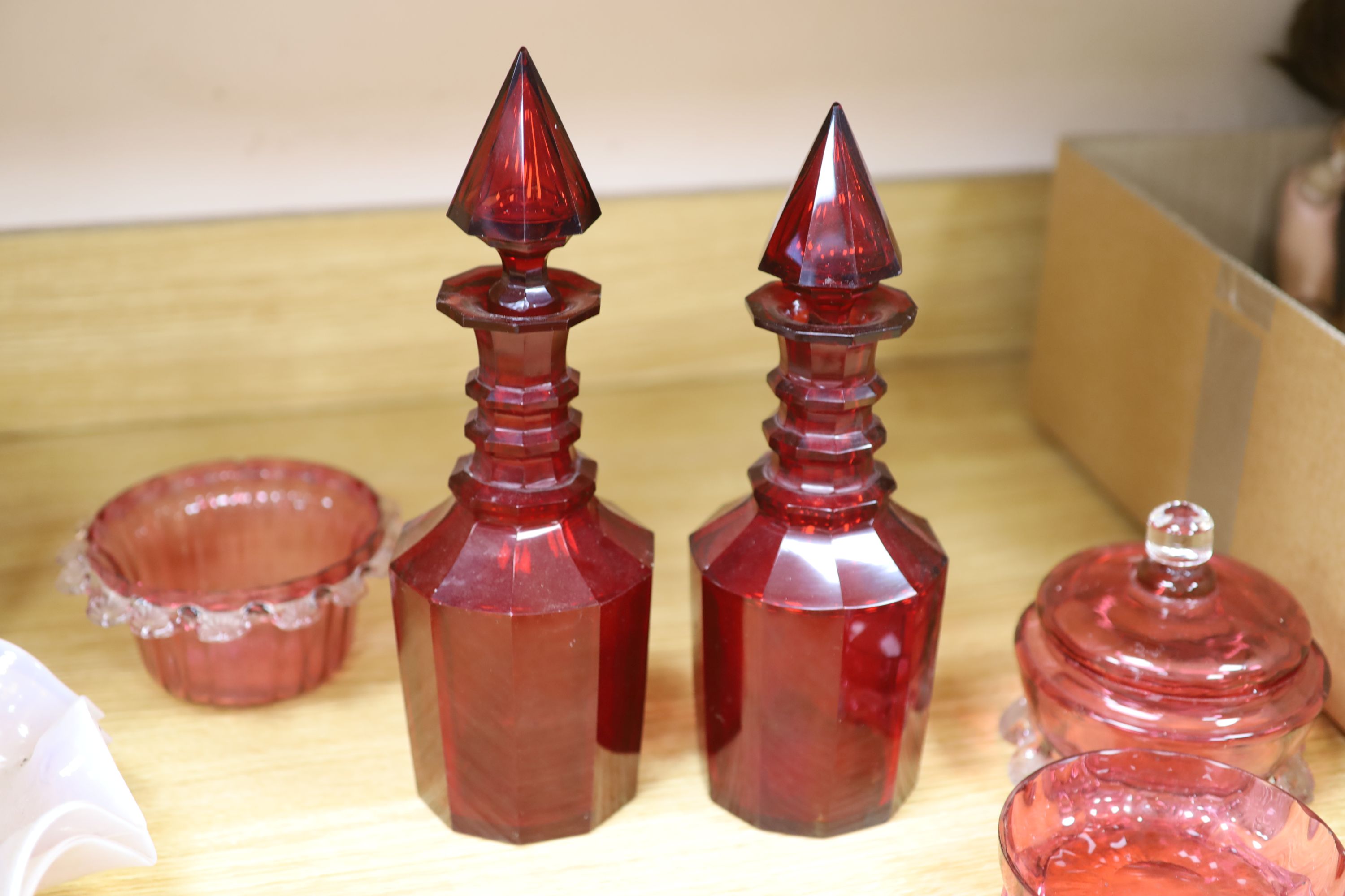 A pair of Victorian ruby glass decanters, cranberry and mixed cut glass